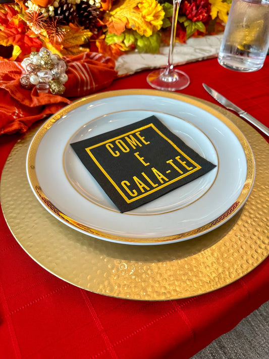 The Come E Cala-Te Cocktail Napkin (50 ct) stylish black cocktail napkins, accented with gold foil. Add a touch of Portuguese flair to your party—perfect for cocktails, tapas, or any festive gathering where friends, family, and fun come together.